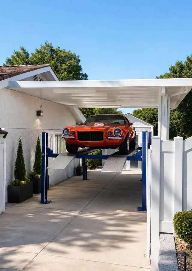 White wood-grain aluminum cover shading a driveway carport with a four-post car lift